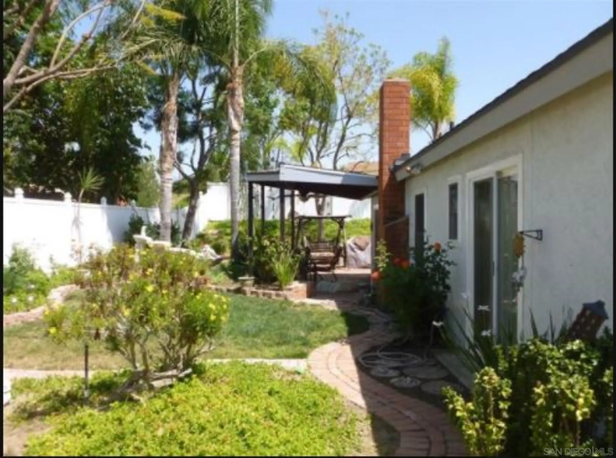 9934 Ivy Street Spring Valley, CA 91977 - Photo 10 of 12 a front view of a house with garden