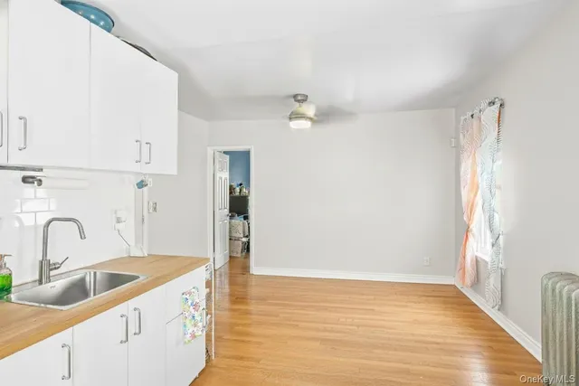 a view of a kitchen sink and a window