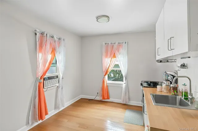a view of a kitchen with furniture and a window