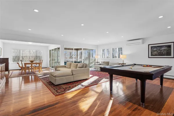 a living room with furniture a rug and a table