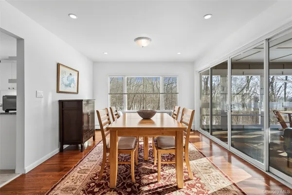 a dining room with a table and chairs