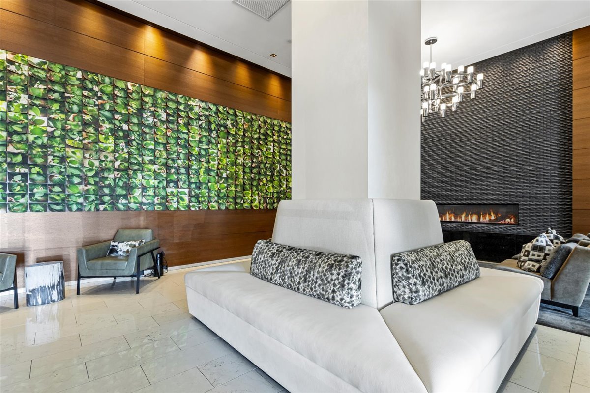 1201 South Prairie Avenue, Unit 403 Chicago, IL 60605 - Photo 23 of 23 a living room with a couch and a chandelier