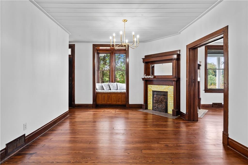 650 Hood School Road Indiana, PA 15701 - Photo 13 of 47 a view of a livingroom with wooden floor a fireplace and window
