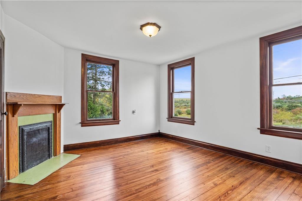 650 Hood School Road Indiana, PA 15701 - Photo 28 of 47 a view of an empty room with wooden floor and a window