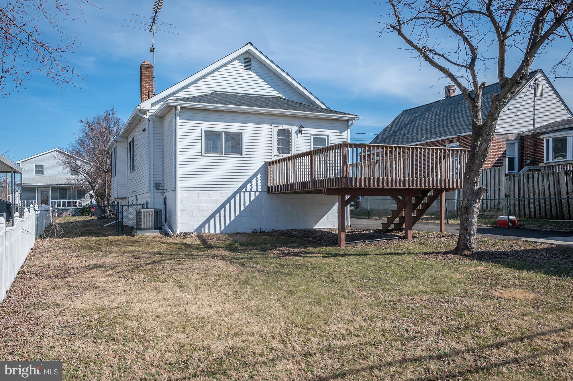 1726 Leslie Road Dundalk, MD 21222 - Photo 26 of 28 a wooden house with large trees and wooden fence