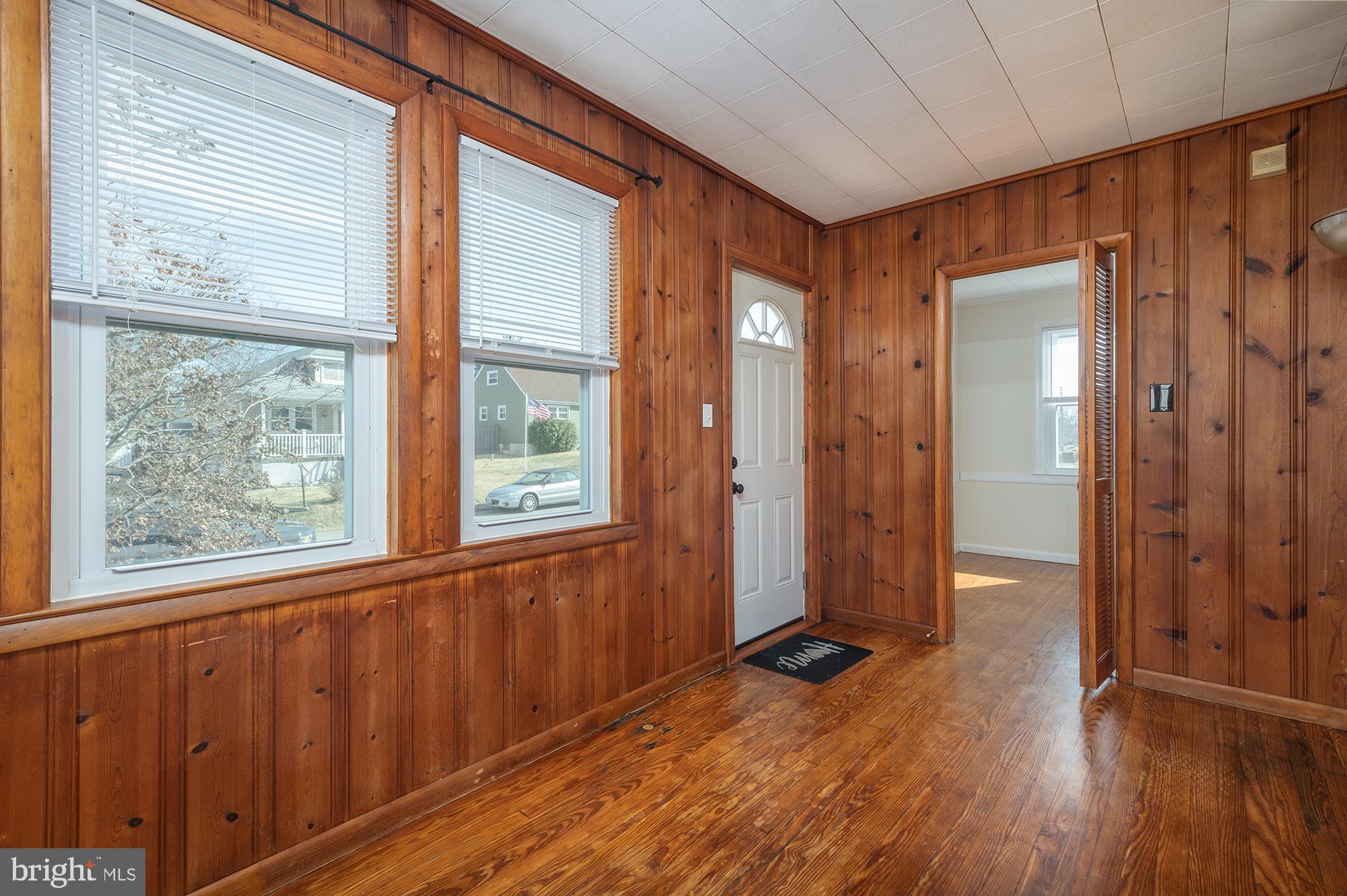 1726 Leslie Road Dundalk, MD 21222 - Photo 5 of 28 a view of a hallway with wooden floor and windows