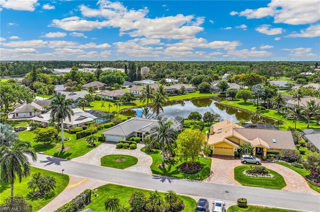 1904 Countess Court Naples, FL 34110 - Photo 31 of 33 an aerial view of residential houses with outdoor space