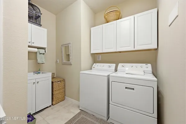 a bedroom with a bed and a table in it