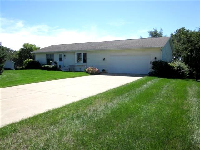 755 Gainsboro Road Lake Summerset, IL 61019 - Photo 1 of 25 a front view of a house with a yard and garage