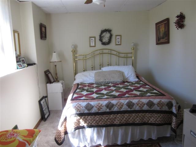 755 Gainsboro Road Lake Summerset, IL 61019 - Photo 8 of 25 a bedroom with a bed and wooden floor