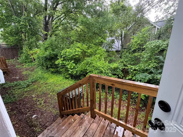 a view of balcony with wooden floor