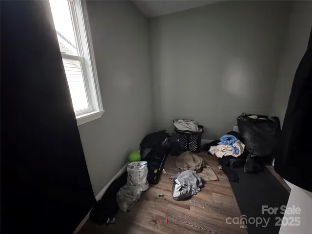 a table with wooden floor and a window