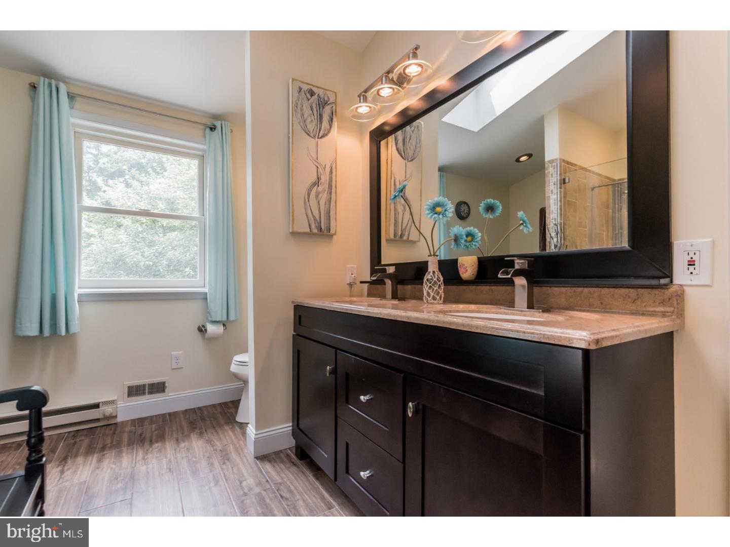 796 Worthington Road Wayne, PA 19087 - Photo 13 of 25 a bathroom with a sink and a mirror