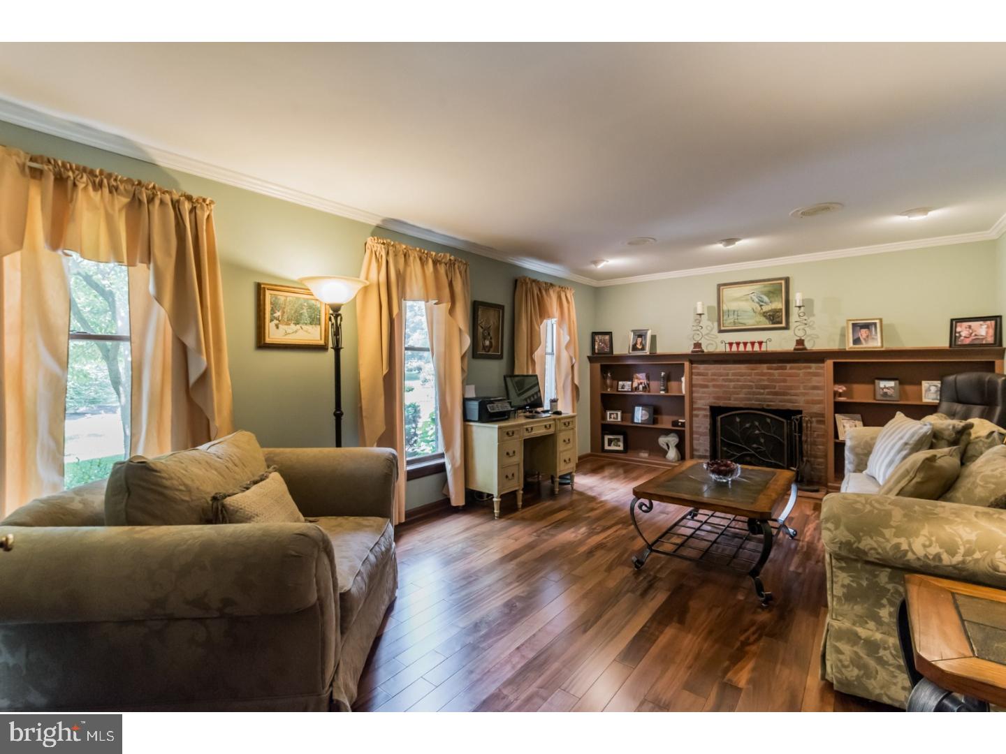 796 Worthington Road Wayne, PA 19087 - Photo 3 of 25 a living room with furniture and a fireplace