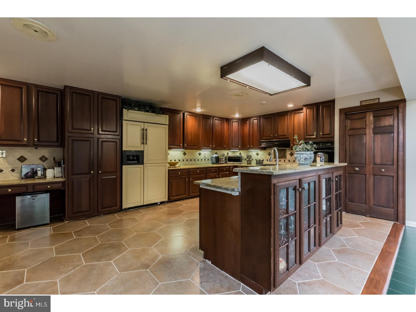 796 Worthington Road Wayne, PA 19087 - Photo 7 of 25 a kitchen with stainless steel appliances granite countertop a stove a refrigerator a sink a oven and a refrigerator