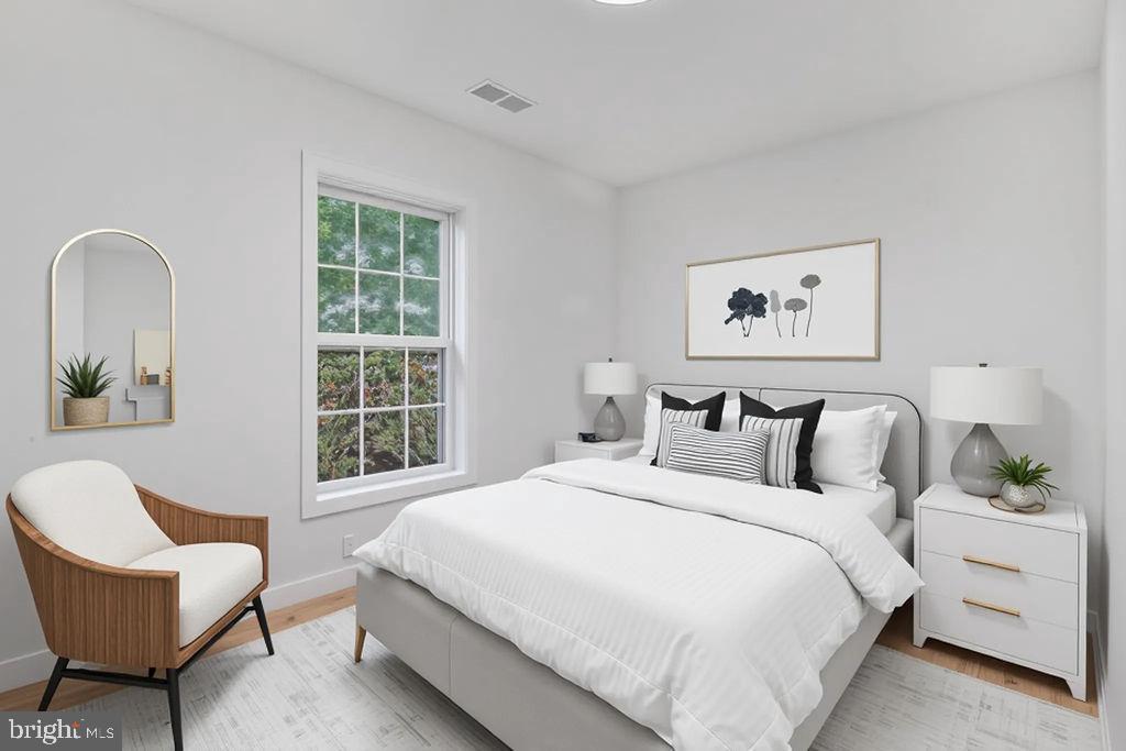 905 Hanover Street Salisbury, MD 21801 - Photo 11 of 40 Serene bedroom with natural light and style.