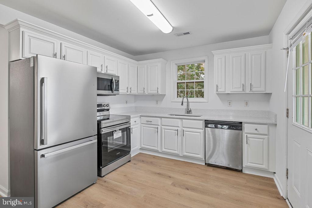 905 Hanover Street Salisbury, MD 21801 - Photo 14 of 40 Modern kitchen with sleek appliances.
