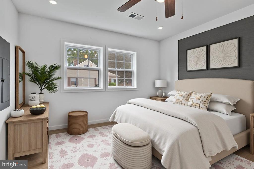 905 Hanover Street Salisbury, MD 21801 - Photo 9 of 40 Serene bedroom with natural light and style.