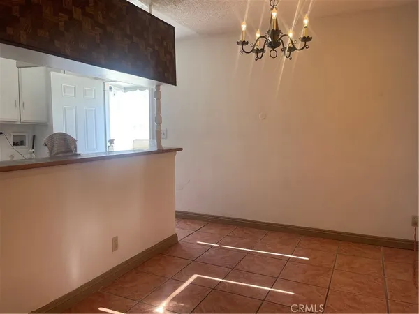 a kitchen with a sink cabinets and a stove top oven
