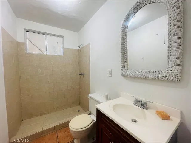 a kitchen with a sink a refrigerator and window