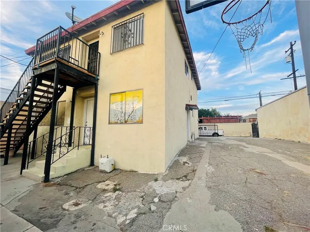 a view of a house with a street