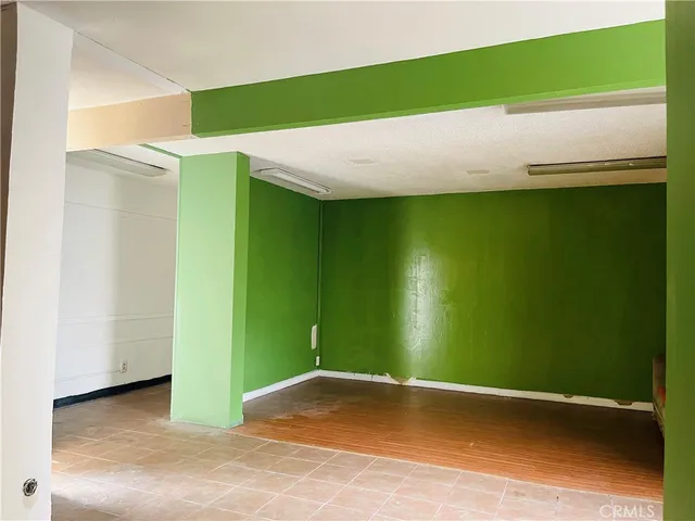 a view of a big room with windows