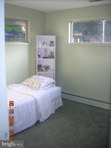 3400 Andover Drive Fairfax, VA 22030 - Photo 11 of 19 a bedroom with a bed and painting on the wall