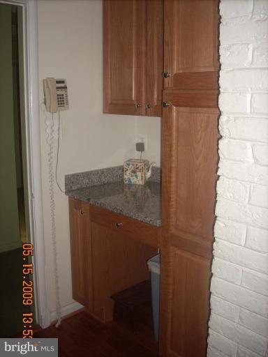 3400 Andover Drive Fairfax, VA 22030 - Photo 12 of 19 a bathroom with a granite countertop sink and a cabinet