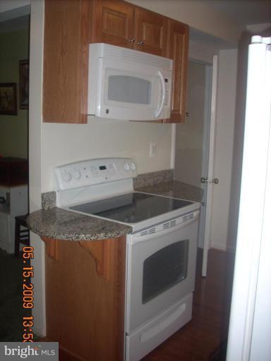 3400 Andover Drive Fairfax, VA 22030 - Photo 13 of 19 a kitchen with a stove and a microwave