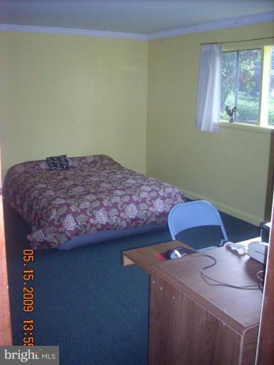 3400 Andover Drive Fairfax, VA 22030 - Photo 17 of 19 a bedroom with a bed and a window