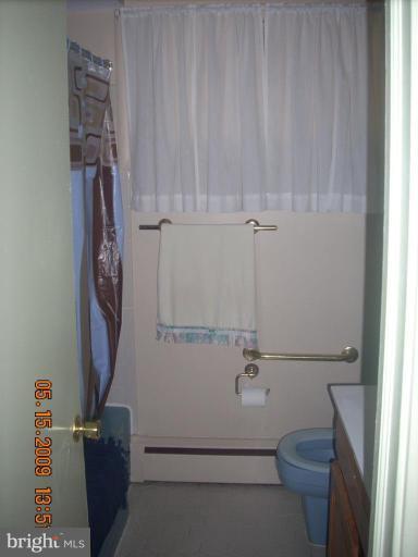 3400 Andover Drive Fairfax, VA 22030 - Photo 8 of 19 a bathroom with a shower and a toilet