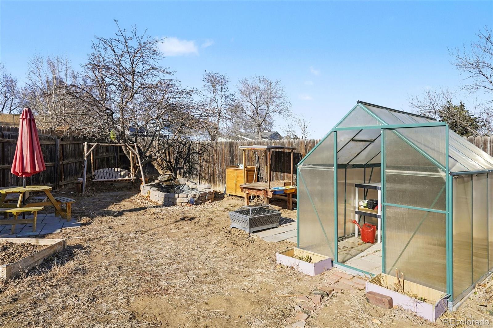 1632 South Rifle Street Aurora, CO 80017 - Photo 19 of 22 a view of a house with a snow on the road