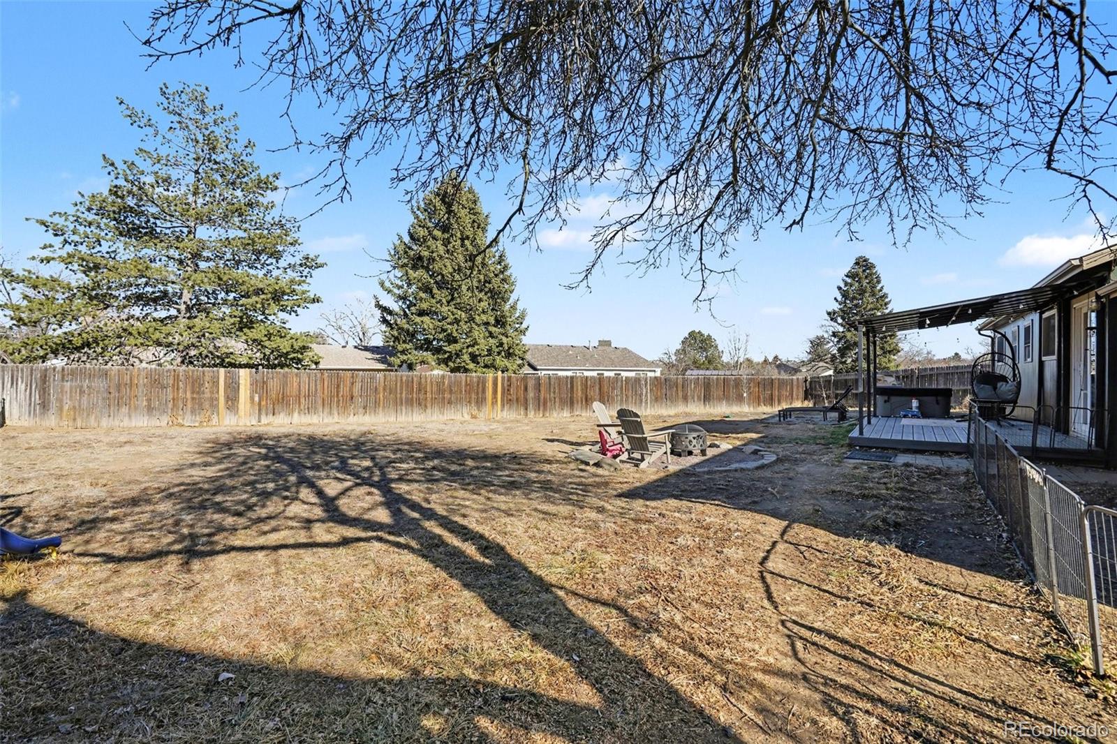 1632 South Rifle Street Aurora, CO 80017 - Photo 20 of 22 a view of a yard with wooden fence