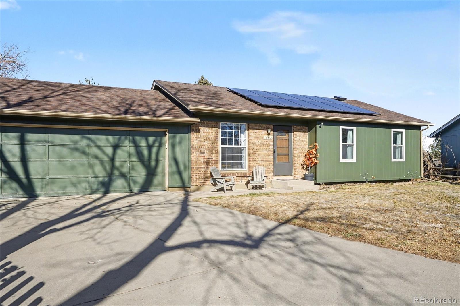 1632 South Rifle Street Aurora, CO 80017 - Photo 3 of 22 a house view with a backyard space