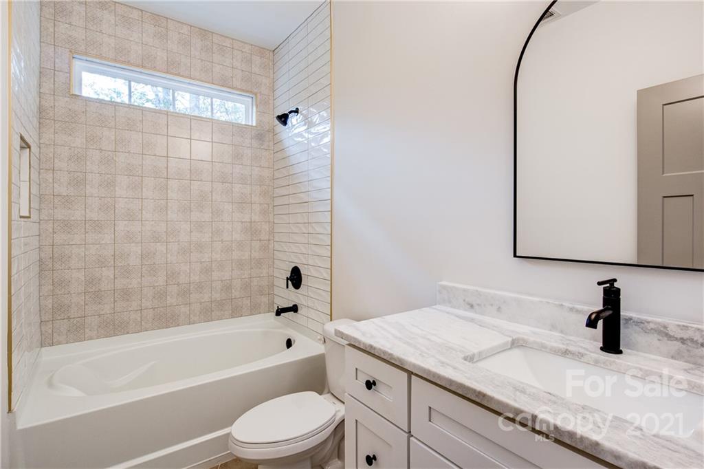 1508 Reservation Road Rock Hill, SC 29730 - Photo 22 of 37 a bathroom with a granite countertop bathtub shower sink vanity and toilet