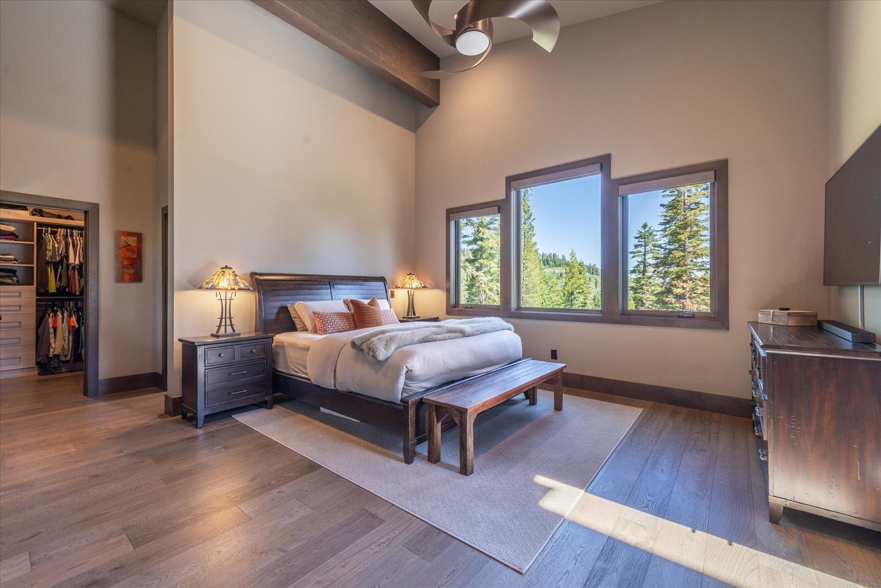 15339 Ski Slope Way Truckee, CA 96161 - Photo 11 of 28 a bedroom with a large bed and a flat tv screen on dresser