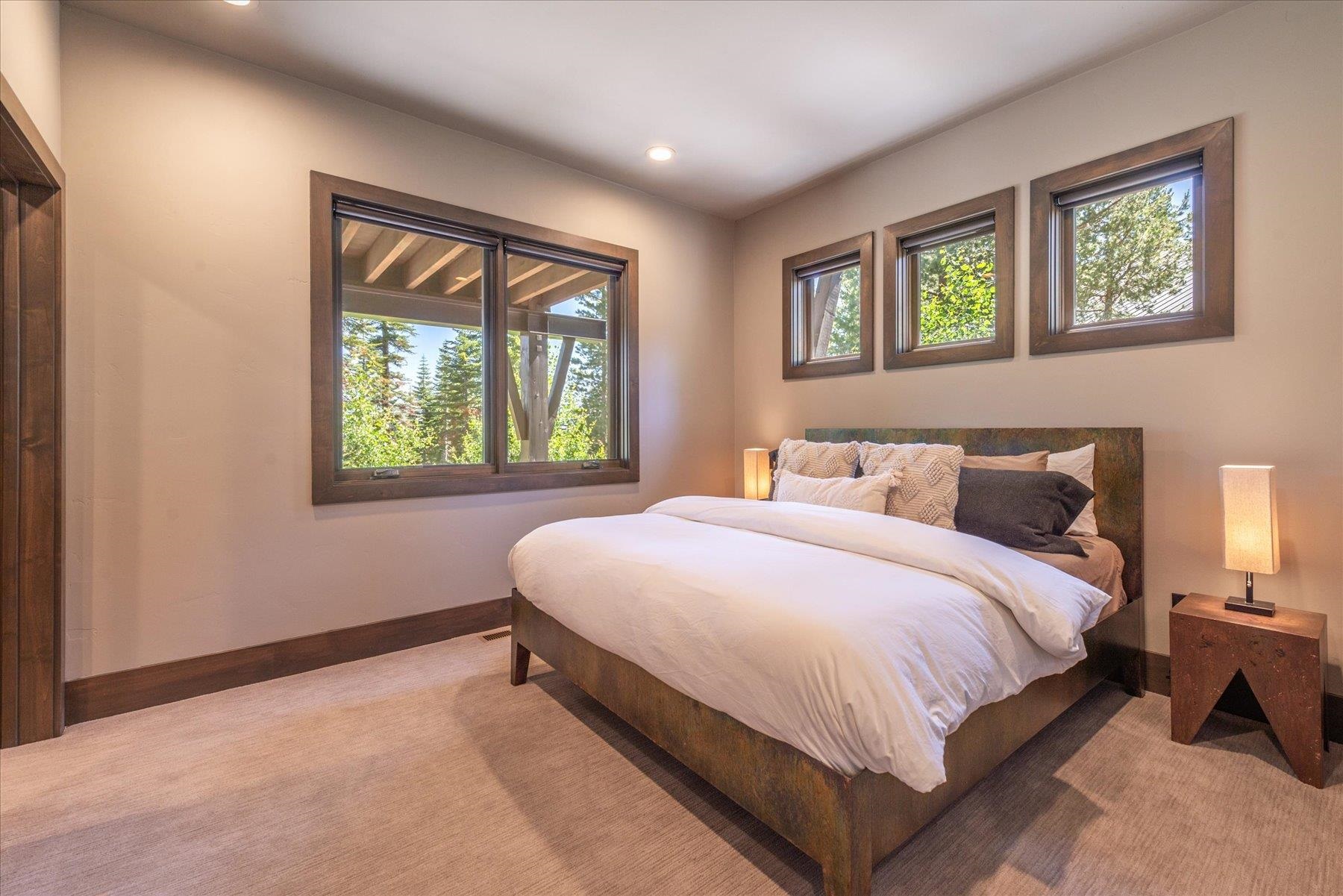 15339 Ski Slope Way Truckee, CA 96161 - Photo 20 of 28 a large bed sitting in a bedroom next to a window