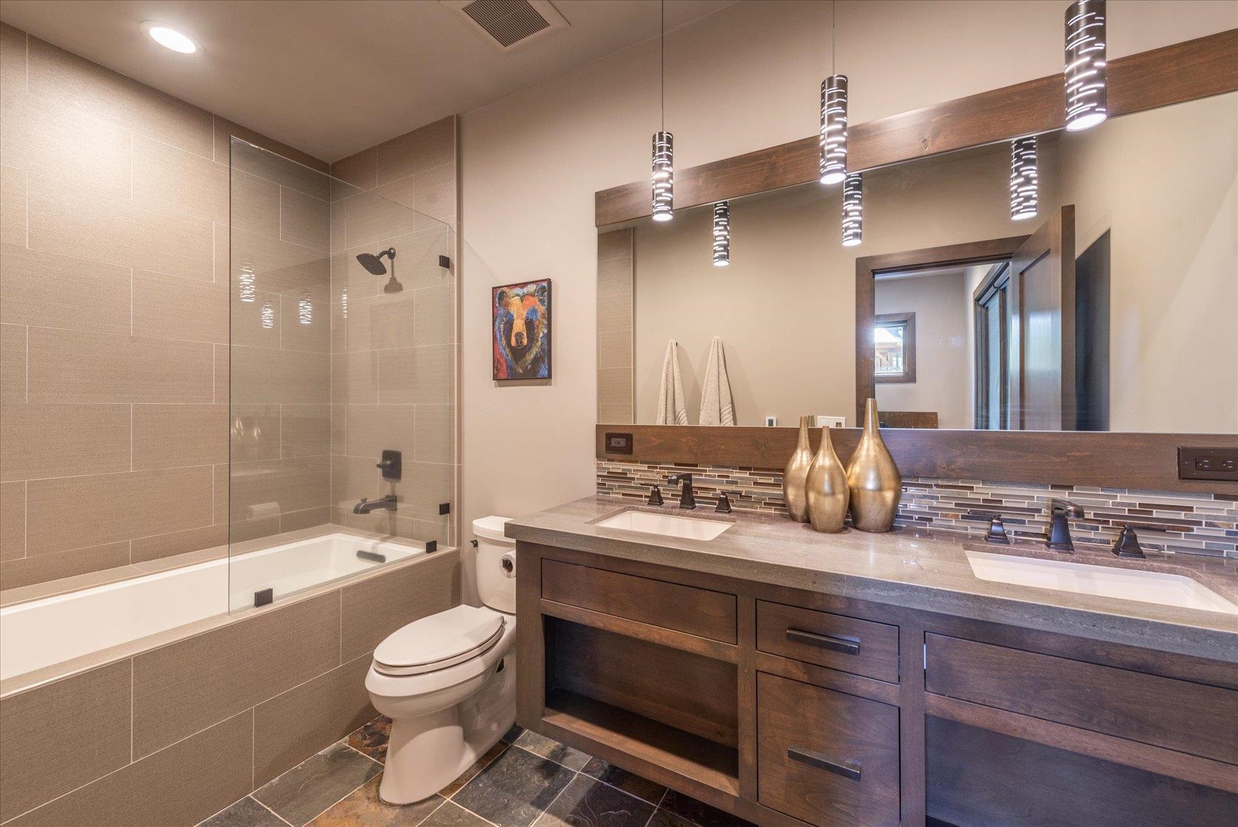 15339 Ski Slope Way Truckee, CA 96161 - Photo 21 of 28 a bathroom with a double vanity sink toilet mirror and bathtub