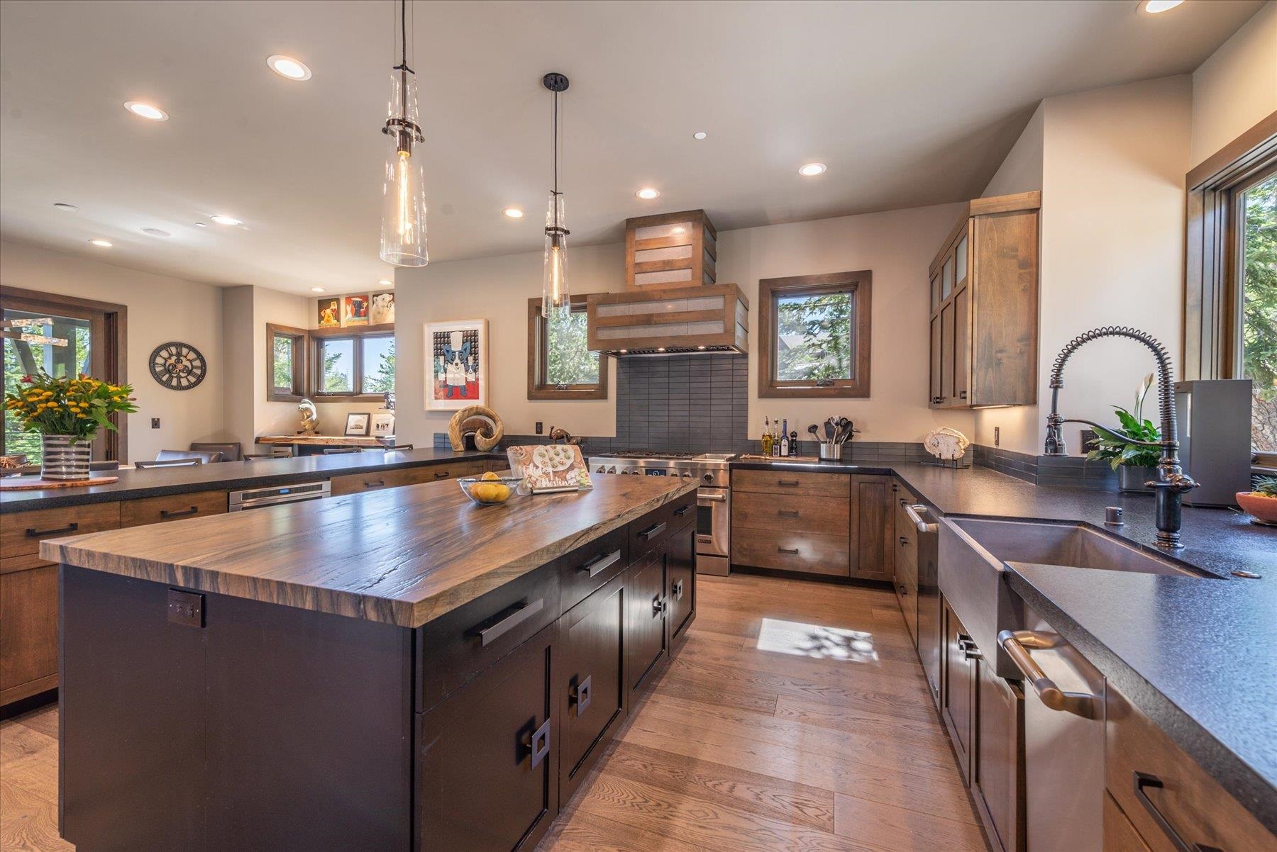 15339 Ski Slope Way Truckee, CA 96161 - Photo 9 of 28 a kitchen with stainless steel appliances granite countertop a sink a stove and a wooden floors
