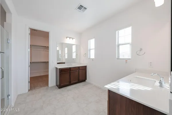 a large bathroom with a granite countertop sink mirror and a bathtub