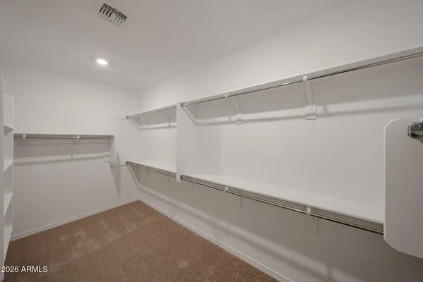 a view of an empty walk in closet