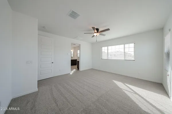 a view of an empty room with a window