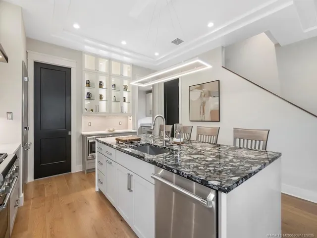 a kitchen with a stove and refrigerator