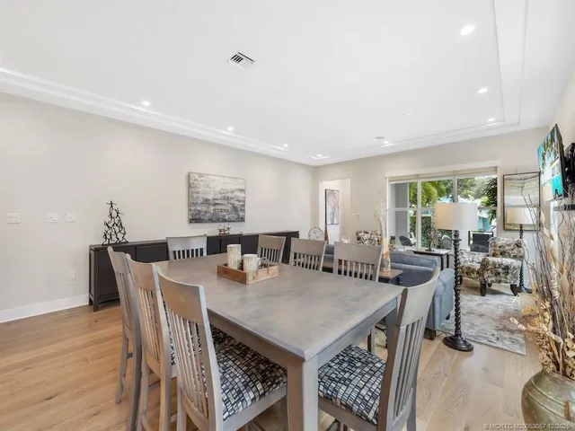 a view of a dining area with furniture and wooden floor