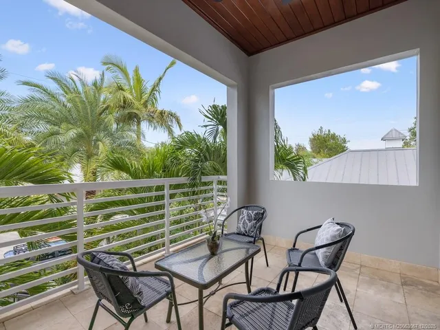 a view of a chairs and table in patio