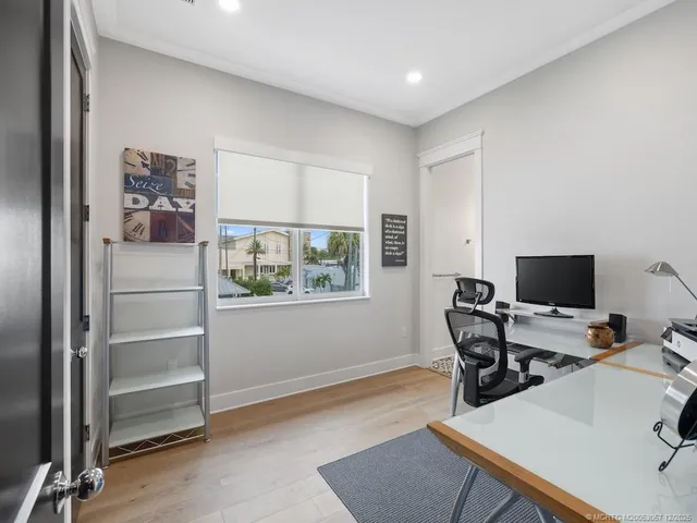 a workspace with furniture and window