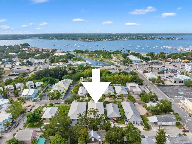 an aerial view of residential houses with outdoor space