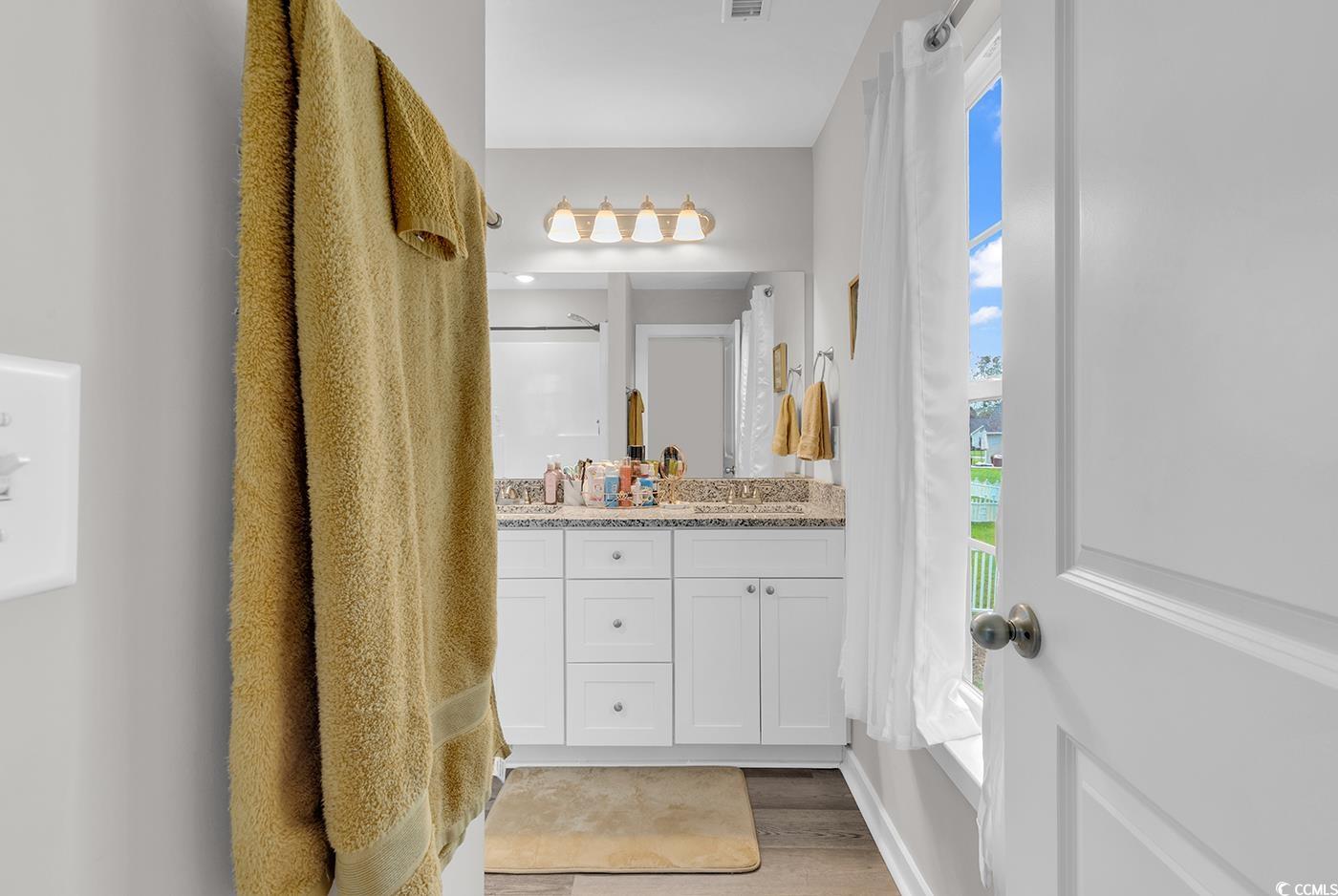 1517 Ackerrose Drive Conway, SC 29527 - Photo 15 of 33 Full bathroom with double vanity and light wood-style floors