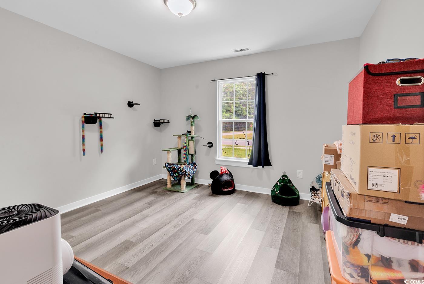 1517 Ackerrose Drive Conway, SC 29527 - Photo 19 of 33 Misc room featuring light wood-type flooring and baseboards