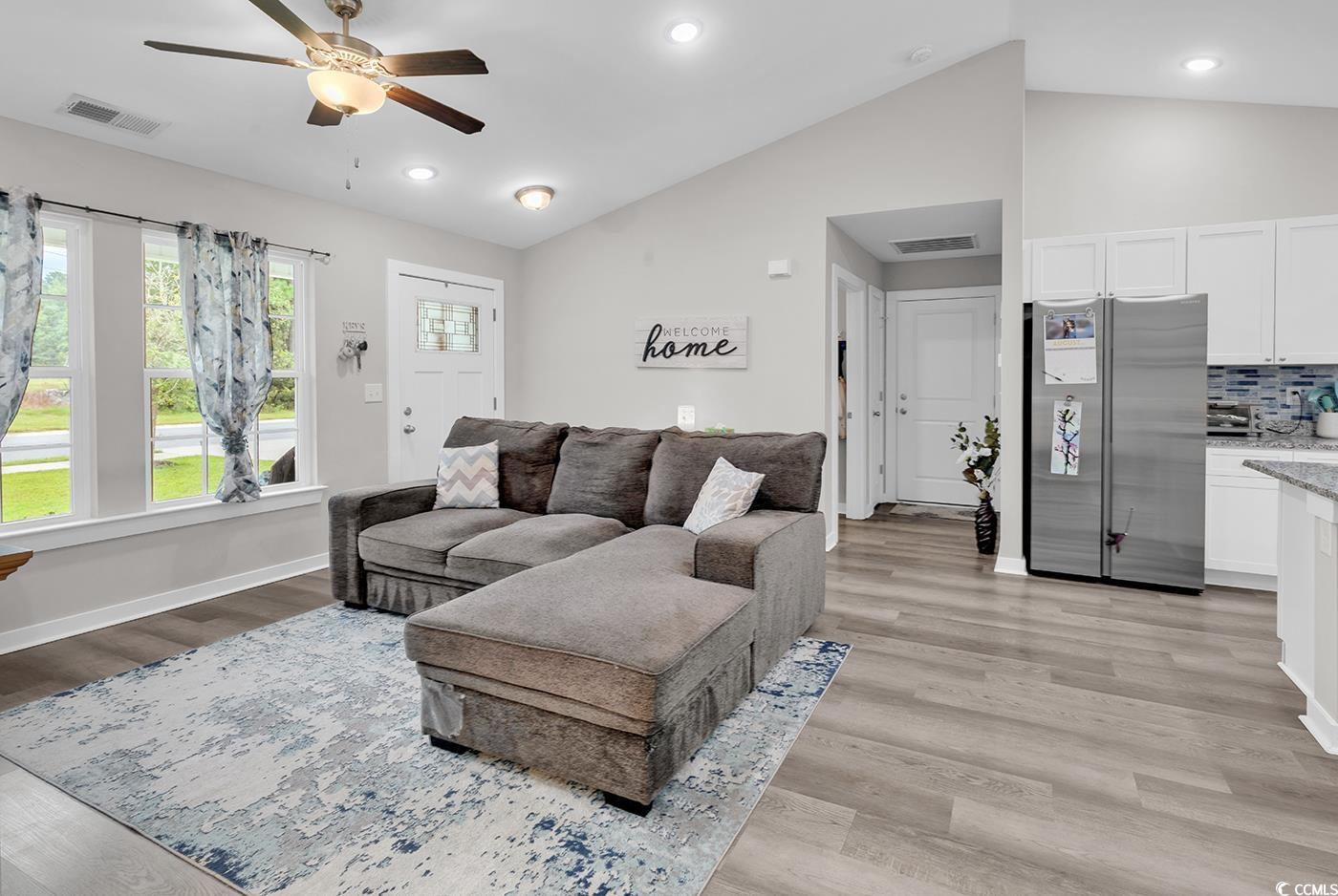 1517 Ackerrose Drive Conway, SC 29527 - Photo 6 of 33 Living area featuring vaulted ceiling, light wood-style flooring, recessed lighting, and a ceiling fan